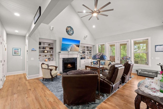 8605 Refuge Point Cir N, Charleston, SC 29420 - living room with ceiling fan, a high end fireplace, built in features, healthy amount of natural light, and high vaulted ceiling