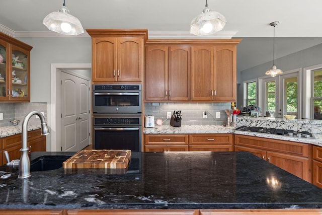 8605 Refuge Point Cir N, Charleston, SC 29420 - kitchen featuring stainless steel appliances, a sink, backsplash, dark stone counters, and crown molding