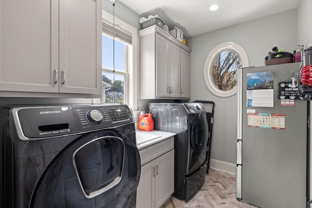 8605 Refuge Point Cir N, Charleston, SC 29420 - laundry area featuring independent washer and dryer, cabinet space, baseboards, and recessed lighting