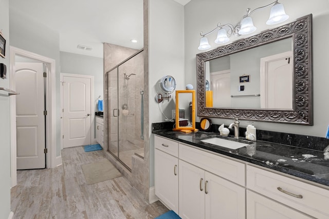 8605 Refuge Point Cir N, Charleston, SC 29420 - bathroom featuring a stall shower, vanity, and wood finished floors