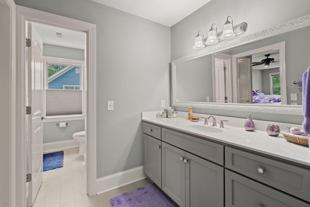 8605 Refuge Point Cir N, Charleston, SC 29420 - bathroom featuring ensuite bathroom, vanity, baseboards, toilet, and a ceiling fan