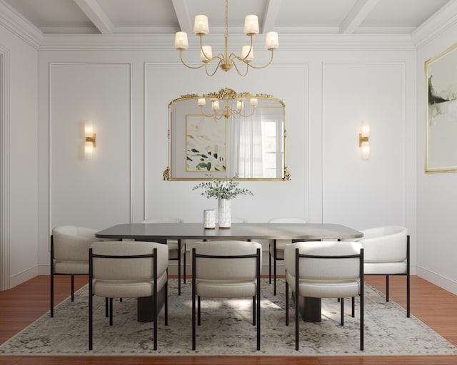 dining room with beamed ceiling, a decorative wall, a chandelier, and wood finished floors