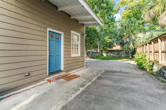 exterior space featuring a patio area and fence