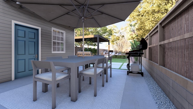 view of patio / terrace with outdoor dining area and fence
