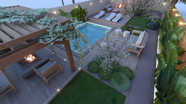 view of swimming pool with an outdoor fire pit and a wooden deck