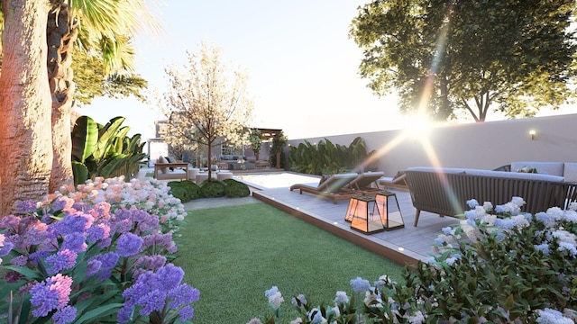 view of yard featuring a wooden deck and outdoor lounge area