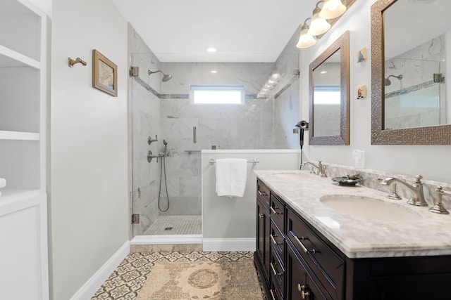 bathroom featuring tile patterned floors, vanity, and a shower with shower door