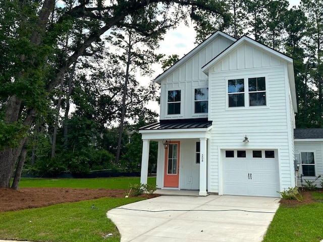 view of front facade with a front yard, a porch, and a garage