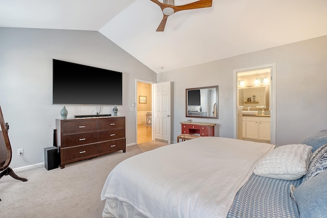 bedroom featuring light carpet, vaulted ceiling, ceiling fan, sink, and connected bathroom