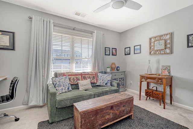 living room featuring ceiling fan and carpet floors