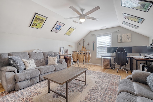 living room with light hardwood / wood-style flooring, ceiling fan, and lofted ceiling