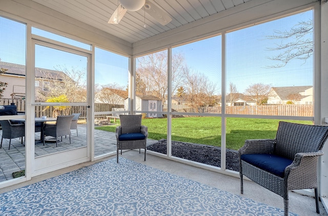 sunroom / solarium with ceiling fan and a healthy amount of sunlight