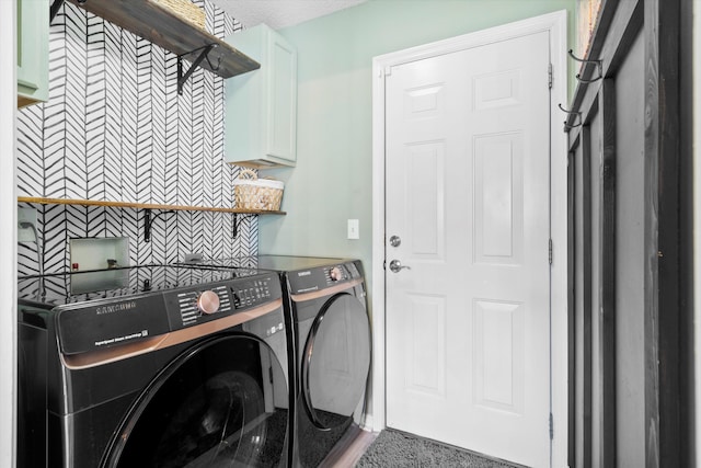 laundry area with washer and dryer and cabinet space