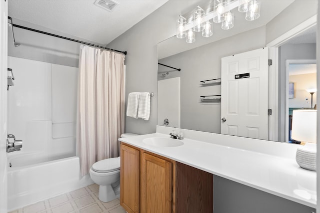 bathroom featuring visible vents, toilet, shower / tub combo with curtain, tile patterned floors, and vanity