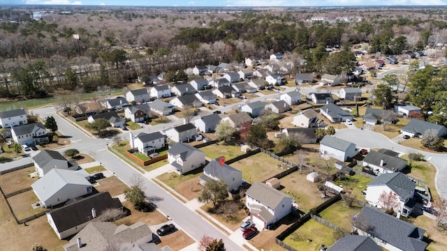 birds eye view of property with a residential view