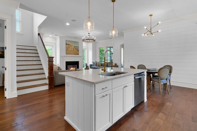 2405 Louisville St, Charleston, SC 29492 - kitchen with a glass covered fireplace, a chandelier, dark wood finished floors, dishwasher, and a sink