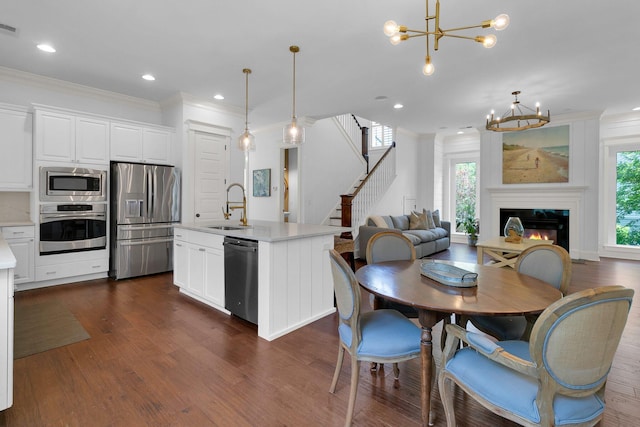 2405 Louisville St, Charleston, SC 29492 - kitchen with light countertops, a sink, stainless steel appliances, open floor plan, and a notable chandelier