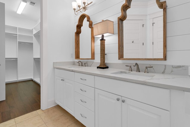 2405 Louisville St, Charleston, SC 29492 - bathroom featuring tile patterned floors, double vanity, visible vents, and a sink