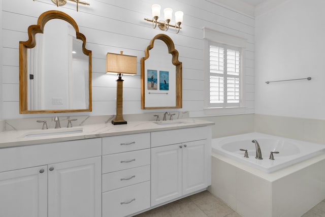 2405 Louisville St, Charleston, SC 29492 - bathroom featuring a bath, double vanity, a sink, and tile patterned floors