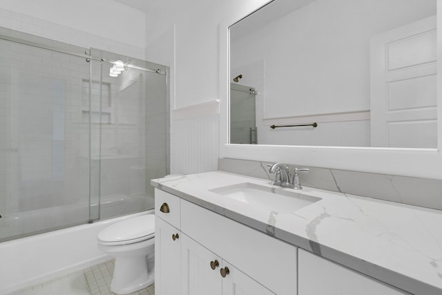 2405 Louisville St, Charleston, SC 29492 - full bath with vanity, bath / shower combo with glass door, a wainscoted wall, toilet, and tile patterned flooring