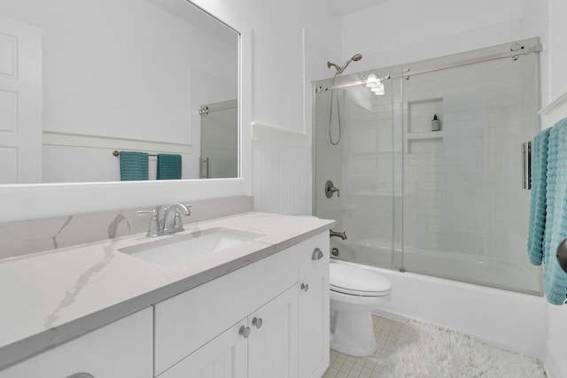 2405 Louisville St, Charleston, SC 29492 - full bath with combined bath / shower with glass door, vanity, toilet, and wainscoting