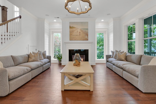 2405 Louisville St, Charleston, SC 29492 - living room featuring a chandelier, crown molding, visible vents, and stairway