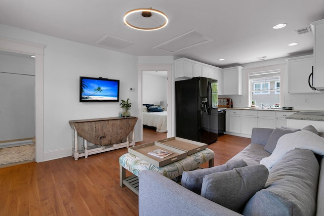 2405 Louisville St, Charleston, SC 29492 - living room with light wood-style flooring, visible vents, recessed lighting, attic access, and baseboards