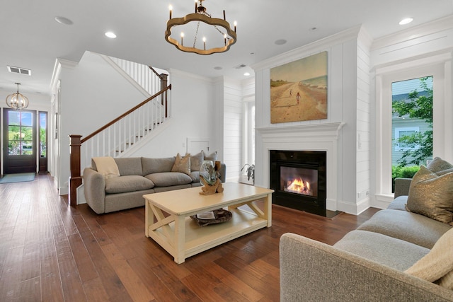 2405 Louisville St, Charleston, SC 29492 - living area with crown molding, an inviting chandelier, dark wood finished floors, visible vents, and stairway
