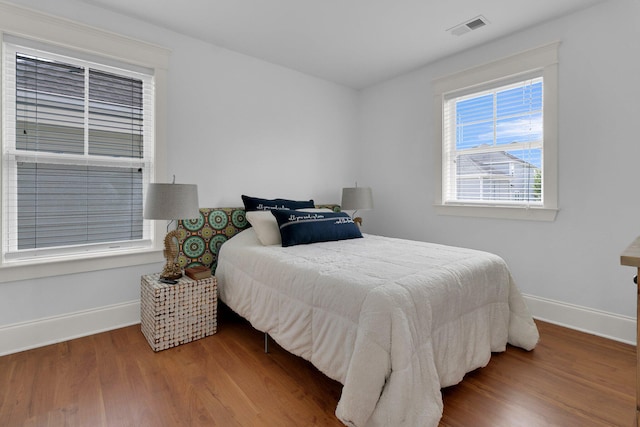 2405 Louisville St, Charleston, SC 29492 - bedroom with baseboards, wood finished floors, and visible vents