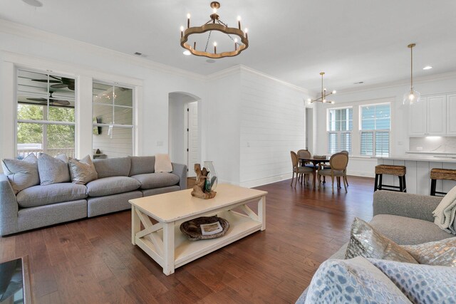 2405 Louisville St, Charleston, SC 29492 - living area with crown molding, arched walkways, a chandelier, and dark wood-style flooring