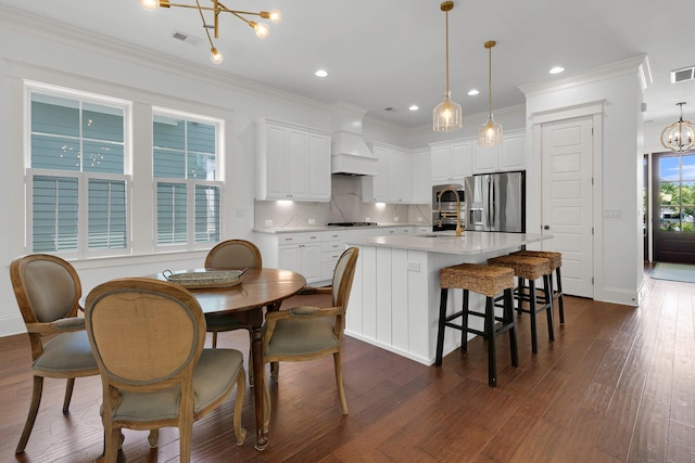 2405 Louisville St, Charleston, SC 29492 - kitchen featuring a chandelier, appliances with stainless steel finishes, dark wood-style flooring, a sink, and custom range hood