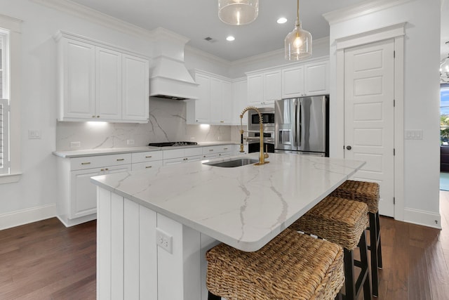 2405 Louisville St, Charleston, SC 29492 - kitchen featuring white cabinets, appliances with stainless steel finishes, custom range hood, baseboards, and dark wood-style floors