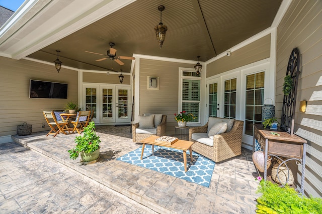 view of patio with an outdoor living space, ceiling fan, and french doors