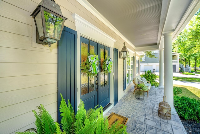 property entrance featuring covered porch
