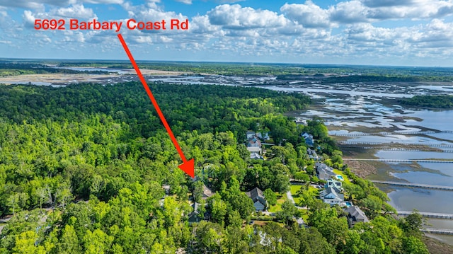 aerial view featuring a water view and a forest view