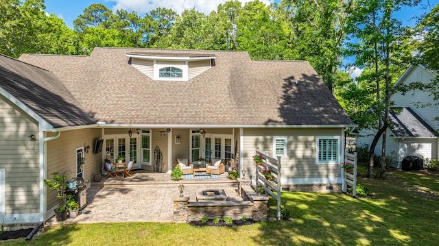back of house featuring an outdoor living space, roof with shingles, a patio area, and a yard