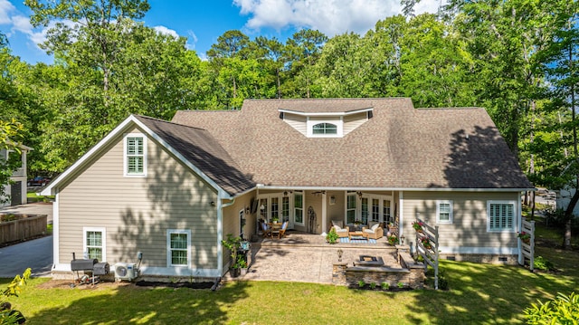 back of house with outdoor lounge area, a shingled roof, a ceiling fan, a patio area, and a lawn