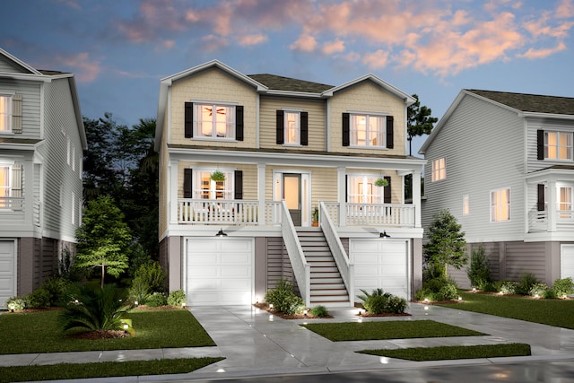 view of front of home featuring covered porch and a garage