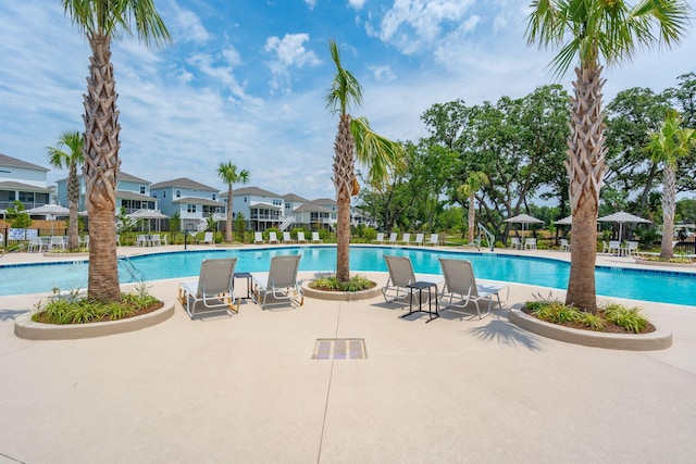 view of swimming pool featuring a patio area