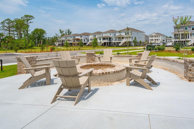 view of patio / terrace with an outdoor fire pit