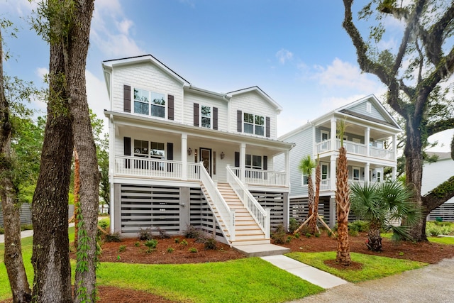 raised beach house featuring a porch