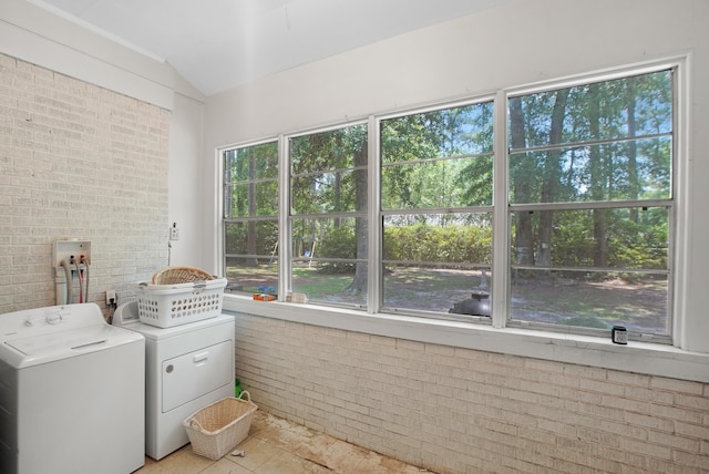 113 Overhill Dr, Walterboro, SC 29488 - washroom with brick wall, healthy amount of natural light, and washing machine and clothes dryer