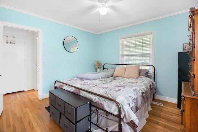 113 Overhill Dr, Walterboro, SC 29488 - bedroom with light wood-style floors, crown molding, baseboards, and a ceiling fan