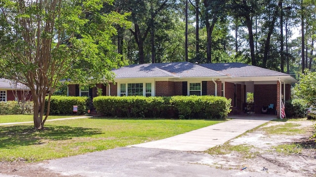 113 Overhill Dr, Walterboro, SC 29488 - single story home with driveway, brick siding, a front yard, and a carport