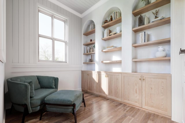 814 Palm Blvd, Isle Of Palms, SC 29451 - sitting room featuring light wood-type flooring, built in features, and ornamental molding