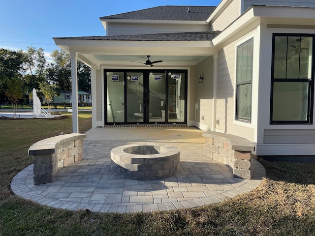 view of patio / terrace featuring ceiling fan and an outdoor fire pit