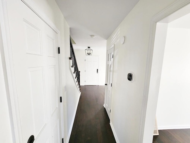 corridor featuring dark hardwood / wood-style floors