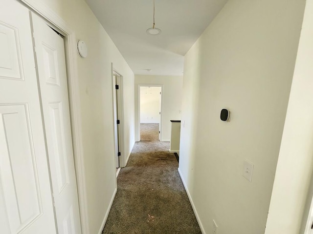 hall with dark carpet