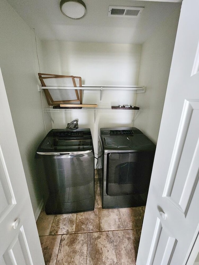 laundry room featuring separate washer and dryer