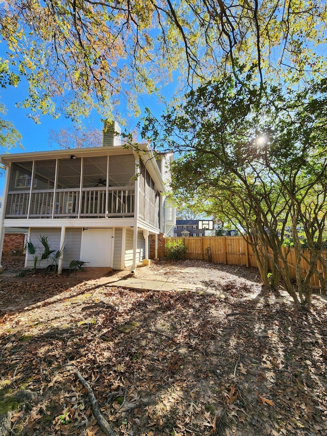 back of house with a sunroom